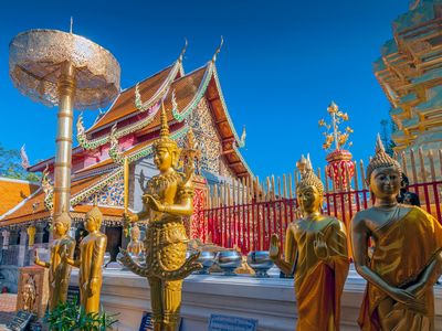 Thailand - Chiang Mai Line of Golden Buddhas at Wat Phrathat Doi Suthep AdobeStock 236505724