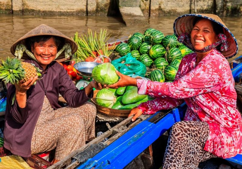 Vietnam Mekong Delta Marktfrauen schwimmender Markt Reise